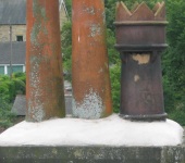 Chimney pots re-seated in mortar by P & AS Hayselden Roofing